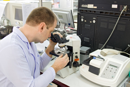 Man working with a microscope
